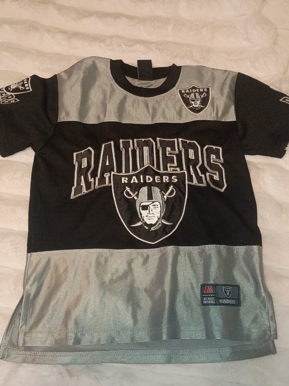 Riders by Lee Black and Silver Raiders Graphic Kids Tee